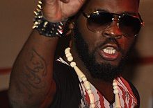 220px-Arafat_Dj_en_prestation_4_(cropped)